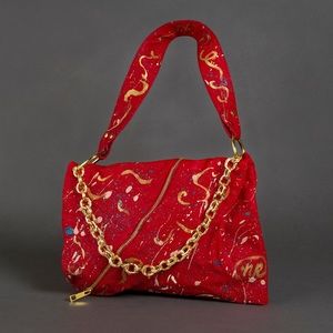 Karma New red painted purse with gold!